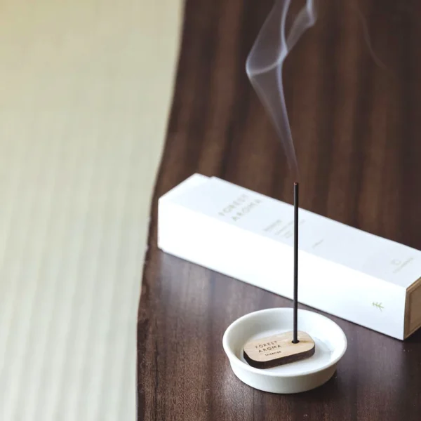 Forest Aroma lit up and placed on a table