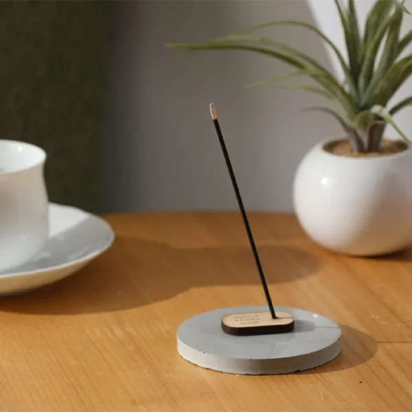 Forest Aroma lit up and placed on a table