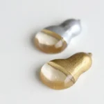 gourd-shaped chopstick rests in silver and gold colours
