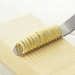 日本製造 吉川不銹鋼牛油刀刮牛油的示範圖