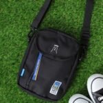 MEI OCEAN × Miffy 長形斜揹袋 黑色, 綠色背景平放俯視展示